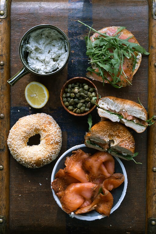 Overhead shot of ingredients of smoked trout bagel
