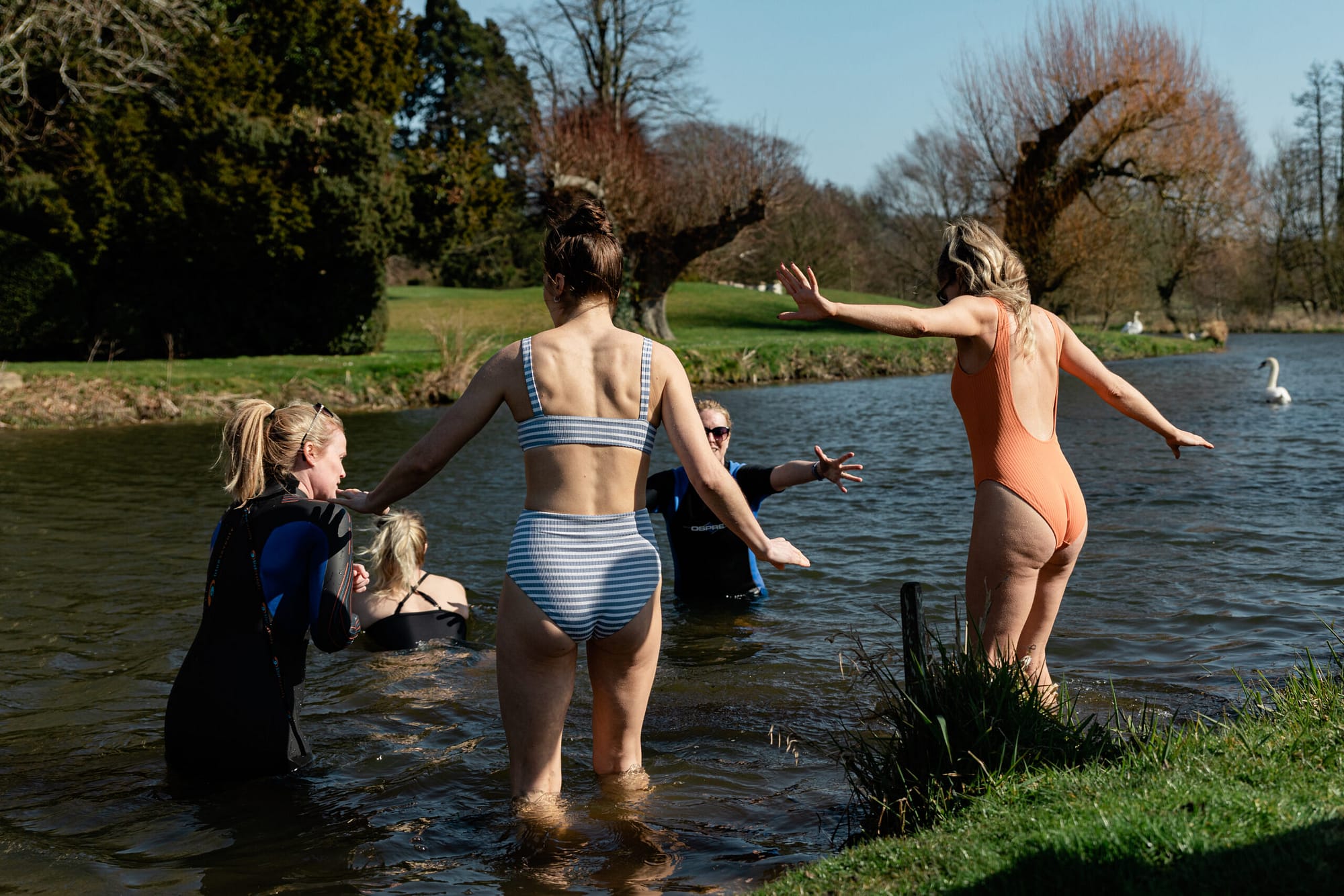 women_entering_the_lake_together_for_a_wild_swim