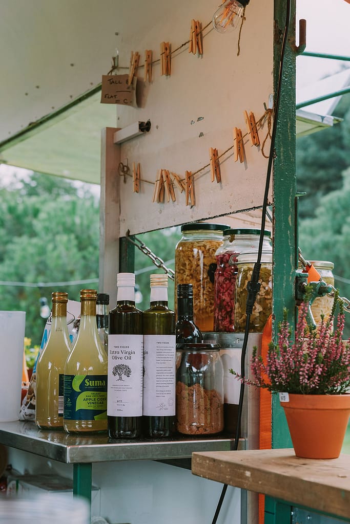 bottles of olive oil and food in food truck