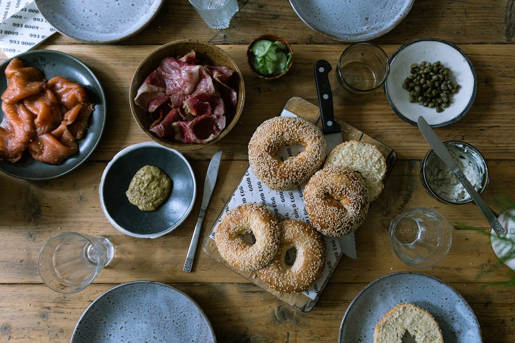 Overhead shot of a table ready for brunch with bagels