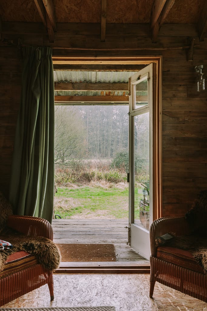 cabin_view_over_meadow