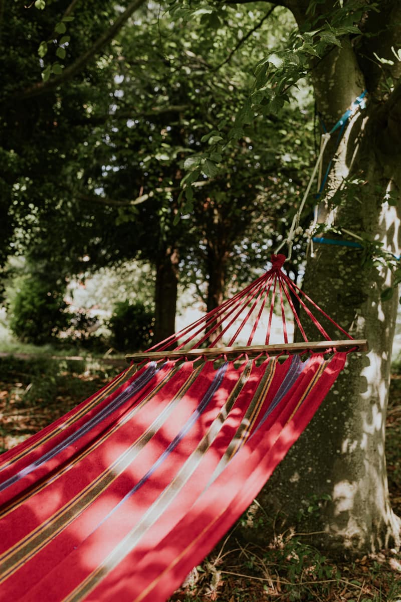red_hammocK-attached_tree