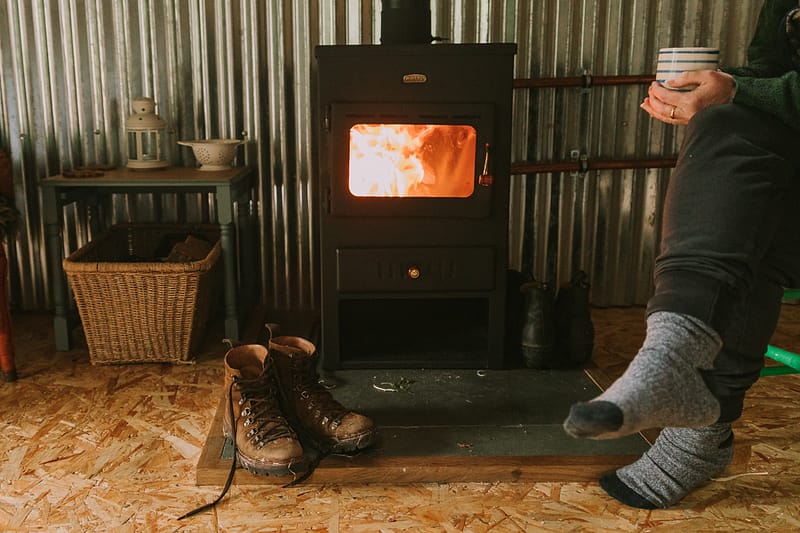 feet_by_fireplace_cabin