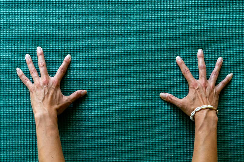hand_on_yoga_mat