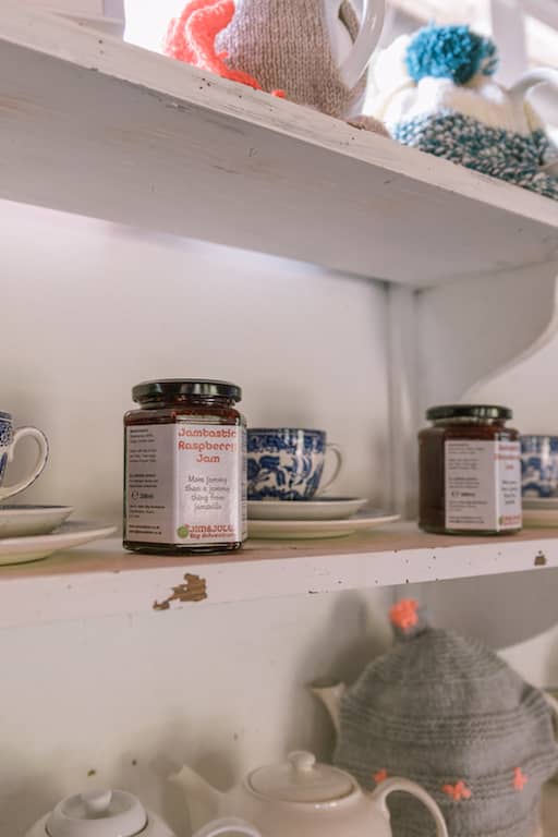 Jars and teapots on shelves 
